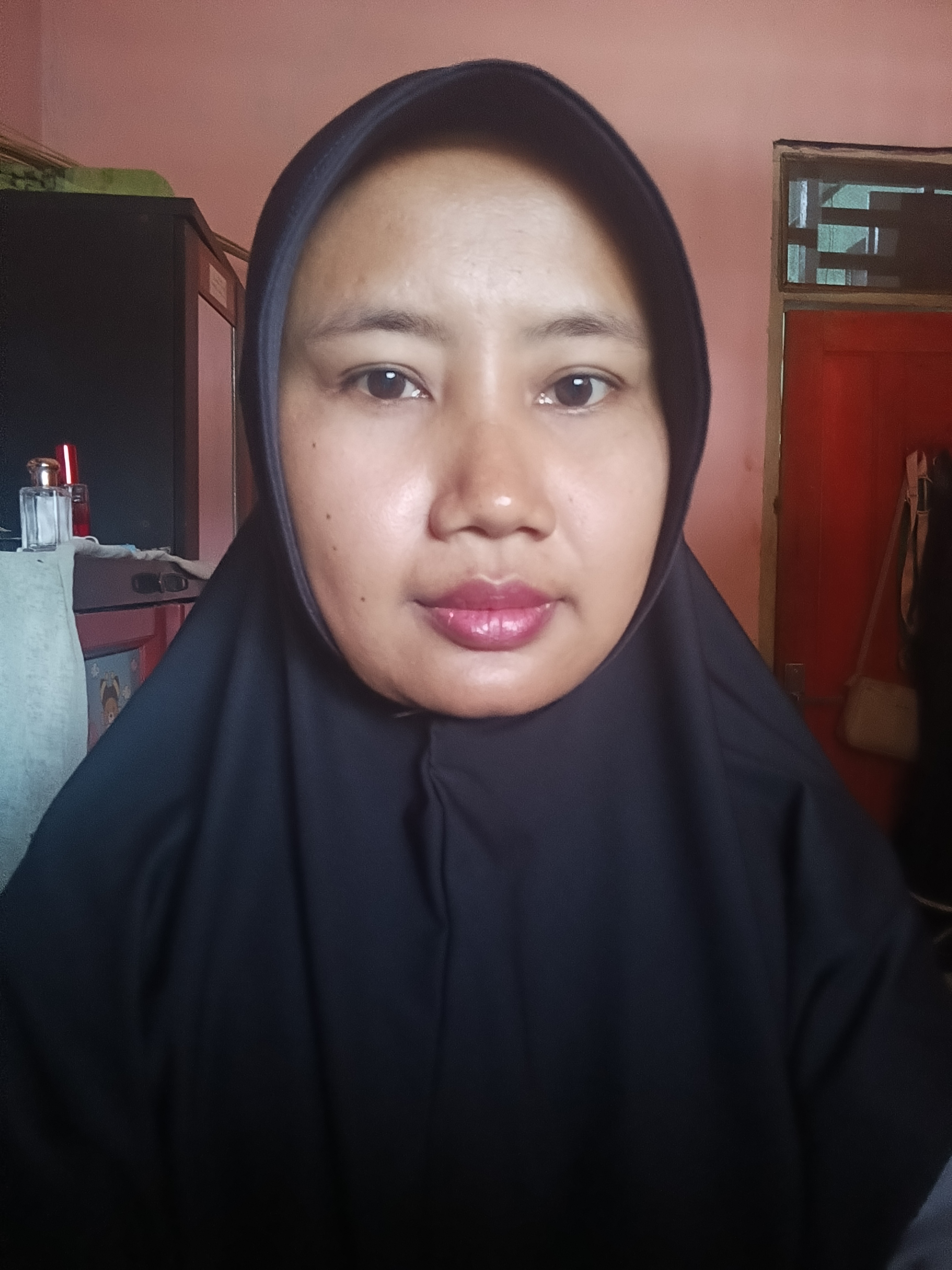 TRI SUHARTINI